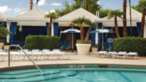 Cabanas and pool chairs next to a pool at the Horseshoe Las Vegas